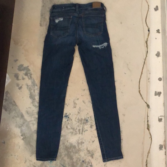 Size 0,  Dark Blue Patch Rip American Eagle Jeans - Picture 2 of 3